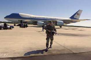 Airforce One sits on tarmack under military
  security
