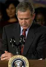 Photo of
	 President George W. Bush Praying