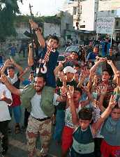 Palestinians cheering in celebration
  after terrorist attacks
