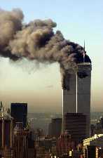 Plumes of smoke from the World Trade
		    Center buildings